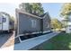 Gray house with white trim, landscaping, and a sidewalk at 1521 Indiana Ave, Columbus, IN 47201