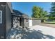 House exterior showcasing a gray-sided addition and a patio area at 1521 Indiana Ave, Columbus, IN 47201