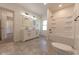 Bathroom with double vanity, tub and tiled floors at 1521 Indiana Ave, Columbus, IN 47201