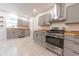 Modern kitchen with gray cabinets and stainless steel appliances at 1521 Indiana Ave, Columbus, IN 47201