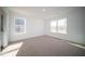 Well-lit bedroom with neutral carpet and large windows at 1114 Fleming Dr, Greenfield, IN 46140