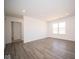 Open living room with wood-look floors and access to bedroom at 1114 Fleming Dr, Greenfield, IN 46140
