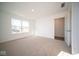 Well-lit bedroom with carpet flooring and access to a closet at 1114 Fleming Dr, Greenfield, IN 46140