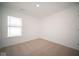 Well-lit bedroom with neutral walls and carpeting at 1114 Fleming Dr, Greenfield, IN 46140
