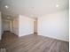 Open living area with wood-look flooring and high ceilings at 1114 Fleming Dr, Greenfield, IN 46140