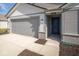 Front view of two-story home with gray siding and attached garage at 1114 Fleming Dr, Greenfield, IN 46140