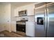 Stainless steel appliances and white cabinetry in this kitchen at 1114 Fleming Dr, Greenfield, IN 46140