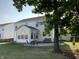 Backyard patio with seating and sunroom addition at 5211 Nicodemus Dr, Plainfield, IN 46168