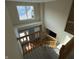 View of a staircase leading to the second floor, with a bright entryway below at 5211 Nicodemus Dr, Plainfield, IN 46168