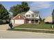 Two-story brick house with a two-car garage at 5211 Nicodemus Dr, Plainfield, IN 46168