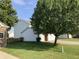 House exterior with white siding and large tree at 5211 Nicodemus Dr, Plainfield, IN 46168