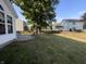 Large backyard with a patio and mature trees at 5211 Nicodemus Dr, Plainfield, IN 46168