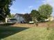 Spacious backyard with a wooden fence and lush lawn at 5211 Nicodemus Dr, Plainfield, IN 46168