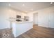 Bright, open kitchen featuring white shaker cabinets, stainless steel appliances, and an island at 6276 Rhinecliff Dr, Whitestown, IN 46075