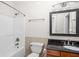 Clean bathroom with shower/tub combo and dark vanity at 970 Fort Wayne Ave # 301, Indianapolis, IN 46202