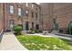 Shared courtyard with brick building and green space at 970 Fort Wayne Ave # 301, Indianapolis, IN 46202