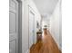 Hallway with hardwood floors leading to dining area at 970 Fort Wayne Ave # 301, Indianapolis, IN 46202