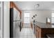 Modern kitchen with granite countertops and stainless steel appliances at 970 Fort Wayne Ave # 301, Indianapolis, IN 46202
