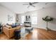 Bright living room with hardwood floors, comfortable seating, and large windows at 970 Fort Wayne Ave # 301, Indianapolis, IN 46202
