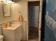 Bathroom with white vanity and shower at 3991 Bennett Dr, Indianapolis, IN 46254