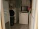 Bright laundry room, washer, dryer, and storage at 3991 Bennett Dr, Indianapolis, IN 46254