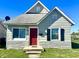 Charming bungalow with a red door and stone accents at 1750 Linden St, Indianapolis, IN 46203