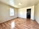 Simple living room with hardwood floors and neutral walls at 1750 Linden St, Indianapolis, IN 46203