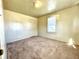 Bright bedroom featuring carpet flooring and a window with blinds at 1750 Linden St, Indianapolis, IN 46203