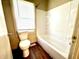 Clean bathroom with a shower/tub combo and vinyl flooring at 1750 Linden St, Indianapolis, IN 46203
