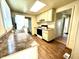 Kitchen with light cabinets, laminate flooring, and a view into the hallway at 1750 Linden St, Indianapolis, IN 46203
