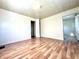Spacious bedroom with wood-look flooring and an additional room at 1750 Linden St, Indianapolis, IN 46203