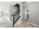 Stairwell with wood railing leading to the second floor at 2684 Cottage Ct, Brownsburg, IN 46112