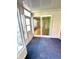Sunroom with sliding door access and tiled floors at 7722 Shady Hills W Dr, Indianapolis, IN 46278