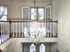 Two-story foyer with chandelier and open staircase at 7722 Shady Hills W Dr, Indianapolis, IN 46278