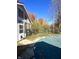 View of the pool and surrounding yard in autumn at 7722 Shady Hills W Dr, Indianapolis, IN 46278