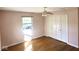 Well-lit bedroom with hardwood floors and double closets at 7722 Shady Hills W Dr, Indianapolis, IN 46278