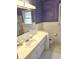 Bathroom features vanity, toilet, and hexagonal tile floor at 7722 Shady Hills W Dr, Indianapolis, IN 46278