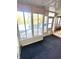 Bright sunroom with view of backyard and pool at 7722 Shady Hills W Dr, Indianapolis, IN 46278