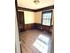 Bedroom with wood paneled walls and hardwood floors at 7722 Shady Hills W Dr, Indianapolis, IN 46278