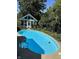 Relaxing kidney-shaped swimming pool, ready for summer fun at 7722 Shady Hills W Dr, Indianapolis, IN 46278