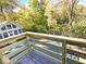 Deck overlooks fenced pool and wooded backyard at 7722 Shady Hills W Dr, Indianapolis, IN 46278