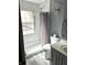 Updated bathroom featuring a walk-in shower and modern vanity at 7722 Shady Hills W Dr, Indianapolis, IN 46278