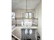 Two-story foyer with chandelier and open staircase at 7722 Shady Hills W Dr, Indianapolis, IN 46278