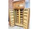 Well-organized kitchen pantry with ample shelving for storage at 7722 Shady Hills W Dr, Indianapolis, IN 46278