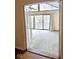 Bright Gathering room featuring hardwood floors and sliding doors to deck at 7722 Shady Hills W Dr, Indianapolis, IN 46278