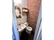 Small bathroom with brick feature wall at 7722 Shady Hills W Dr, Indianapolis, IN 46278