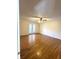 Large main bedroom with hardwood floors and access to a patio at 7722 Shady Hills W Dr, Indianapolis, IN 46278