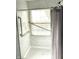 Walk-in shower with grab bars and marble tile at 7722 Shady Hills W Dr, Indianapolis, IN 46278