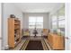 Bright office with built-in shelving and two comfortable armchairs at 8915 Faulkner Dr, Indianapolis, IN 46239
