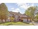 Two-story house with brick and siding, a three-car garage, and a landscaped yard at 7933 Buckthorn Ct, Avon, IN 46123